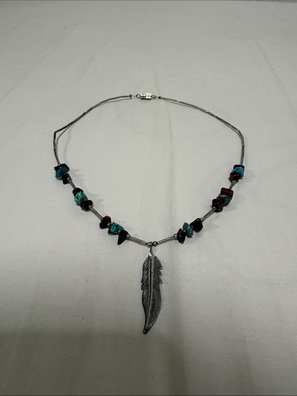 Silver Feather Pendant Necklace with Turquoise and Red Stone Accents